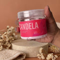 Candela X3 crema reductora frasco en podio de piedra